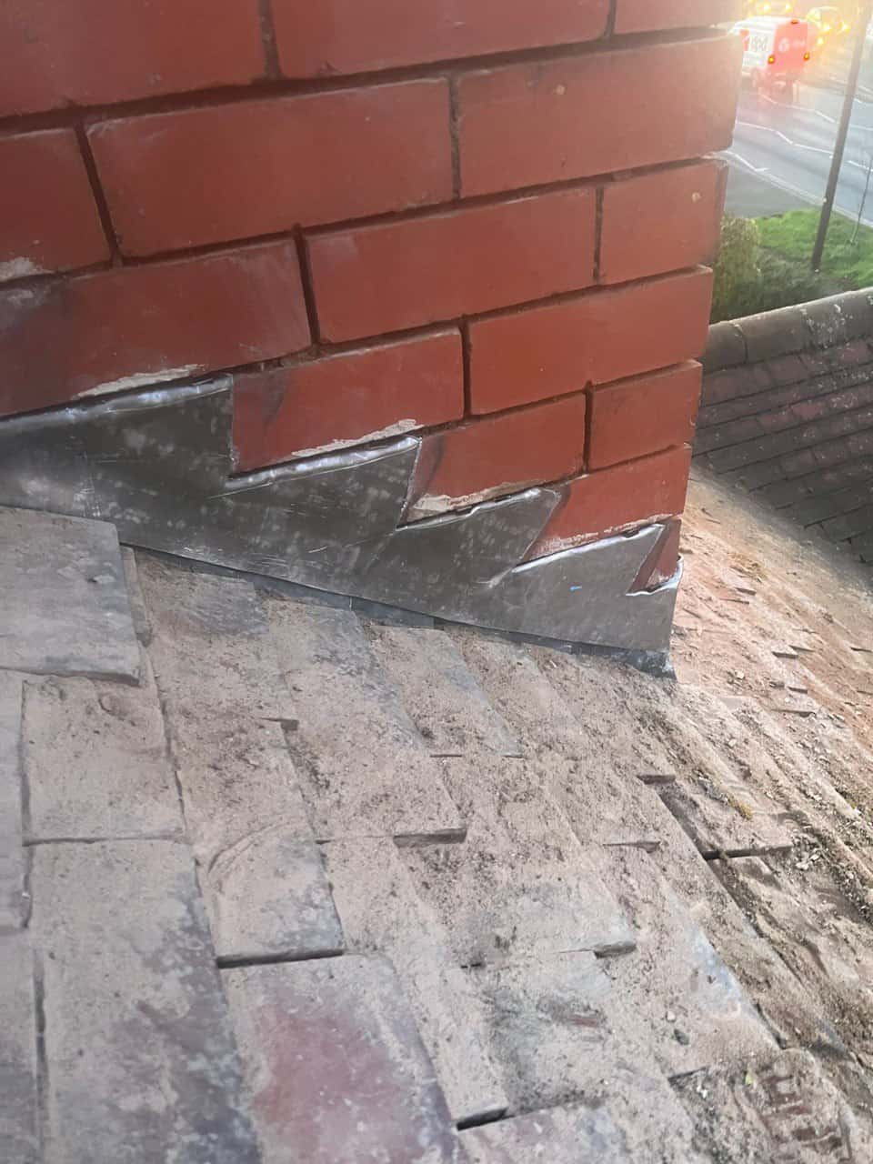 This is a photo of new leadwork being installed around an old chimney. Works carried out by Southampton Roofing Repairs